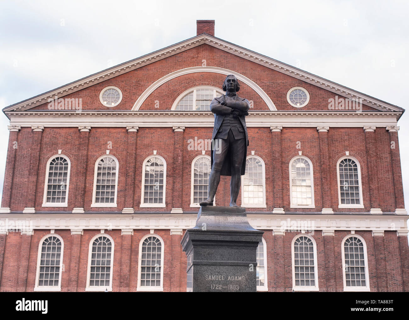 Boston, Massachusetts.  October 30, 2019. The red brick exterior architecture of the historic faneuil hall behind the samuel adam statue in Boston Mas Stock Photo