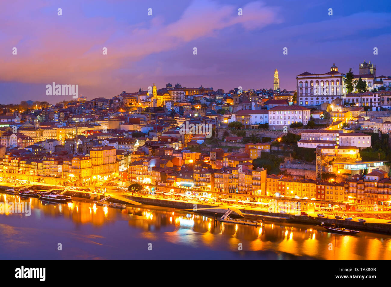 Skyline of Porto illuminated old town at twilights, Douro river, Portugal Stock Photo