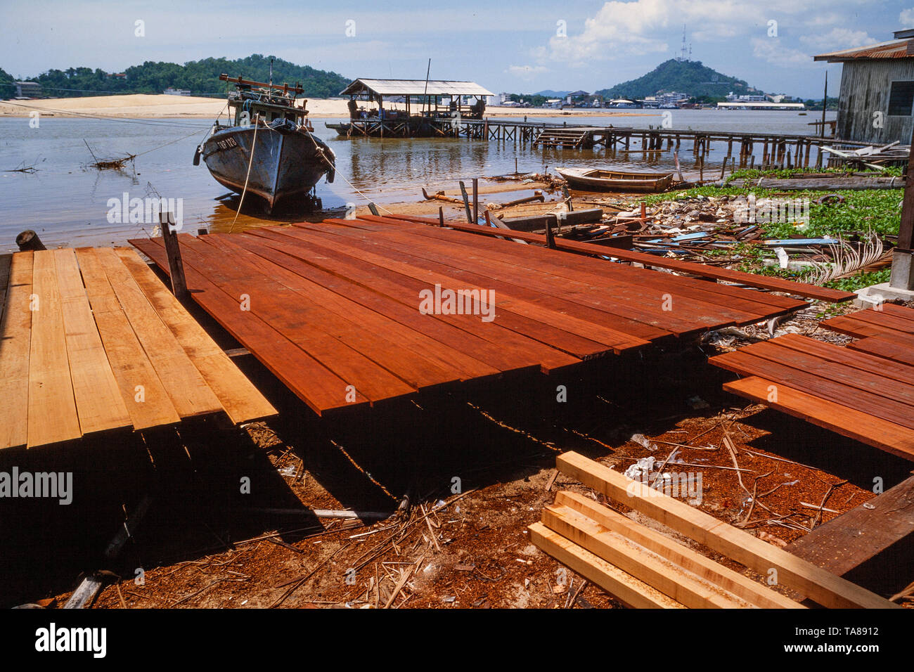 Hardwood planks, boat yard, Malaysia Stock Photo