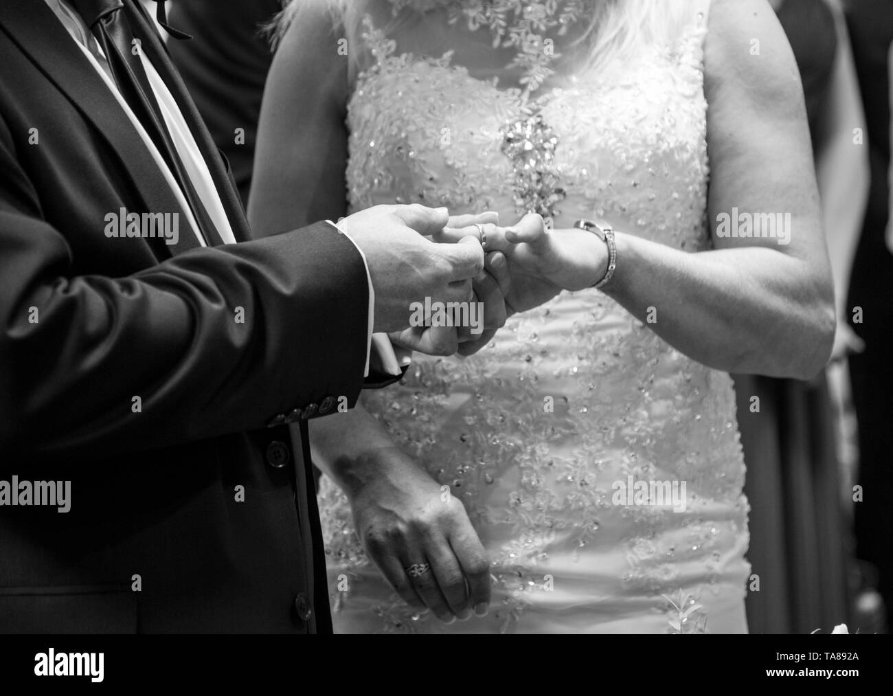 Bride and grooms hands on their wedding day, close up of Bride and Grooms hands at their wedding on their Wedding Day in Worcestershire England, UK Stock Photo