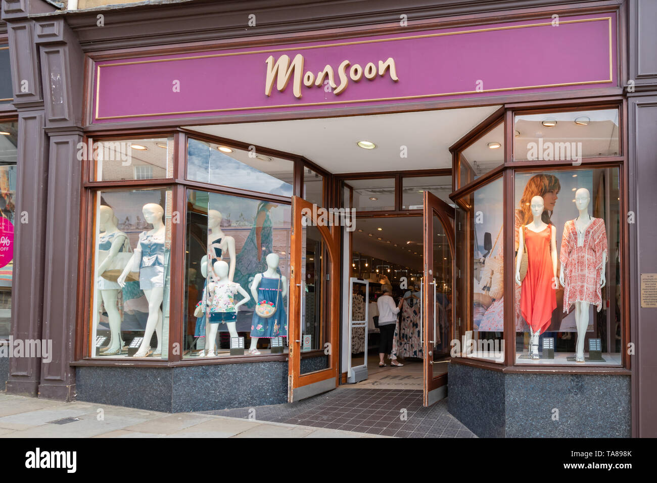 Monsoon shop front, a store selling womens and childrens clothing, on the high street in Guildford town centre, Surrey, UK Stock Photo