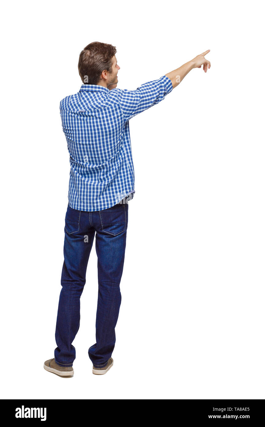 Back view of pointing young men talking on cell phone. Young guy ...