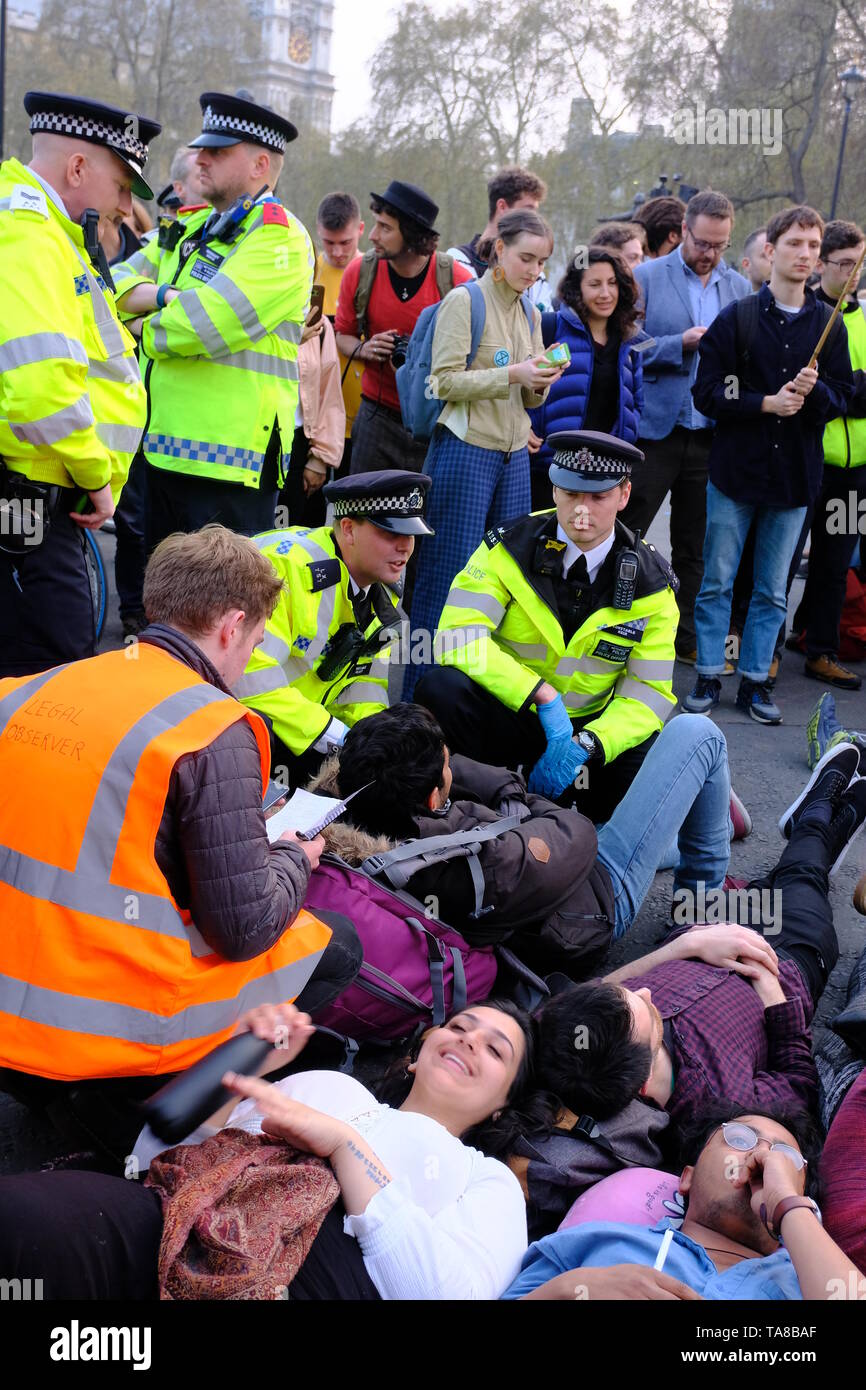 'Arrestable' Extinction Rebellion protesters being read Section 14 Notice of the Public Order Act 1986, Parliament Square on day 3 of protest Stock Photo