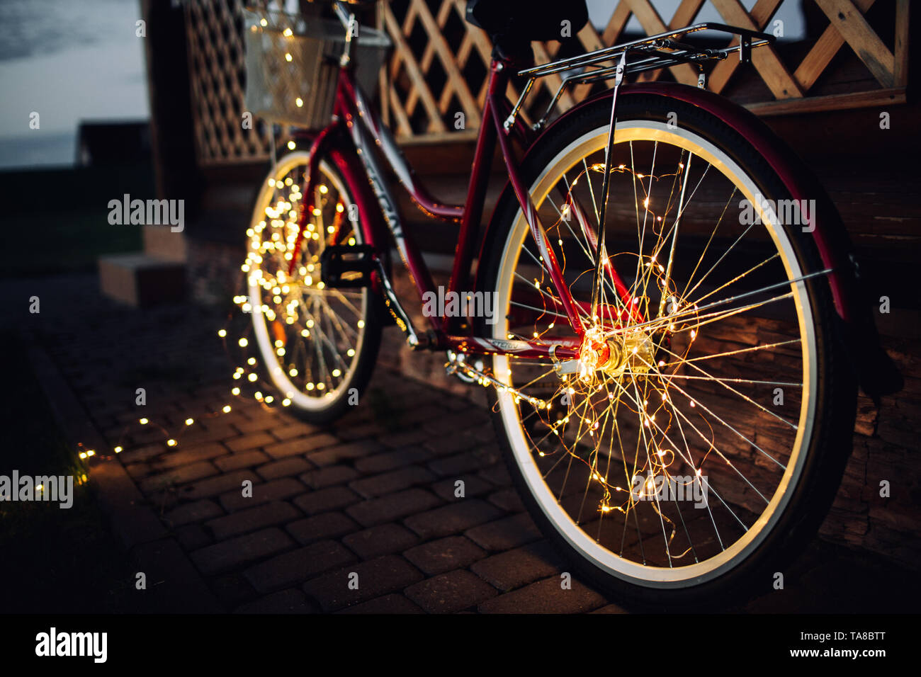 Christmas lights on bike background texture in city Stock Photo Alamy