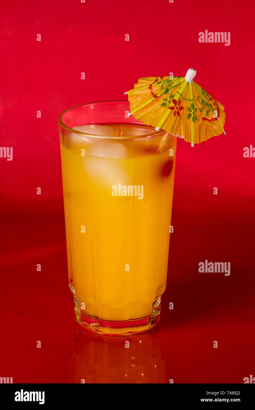 Vodka and Orange juice mixed drink with a cocktail umbrella Stock Photo Alamy