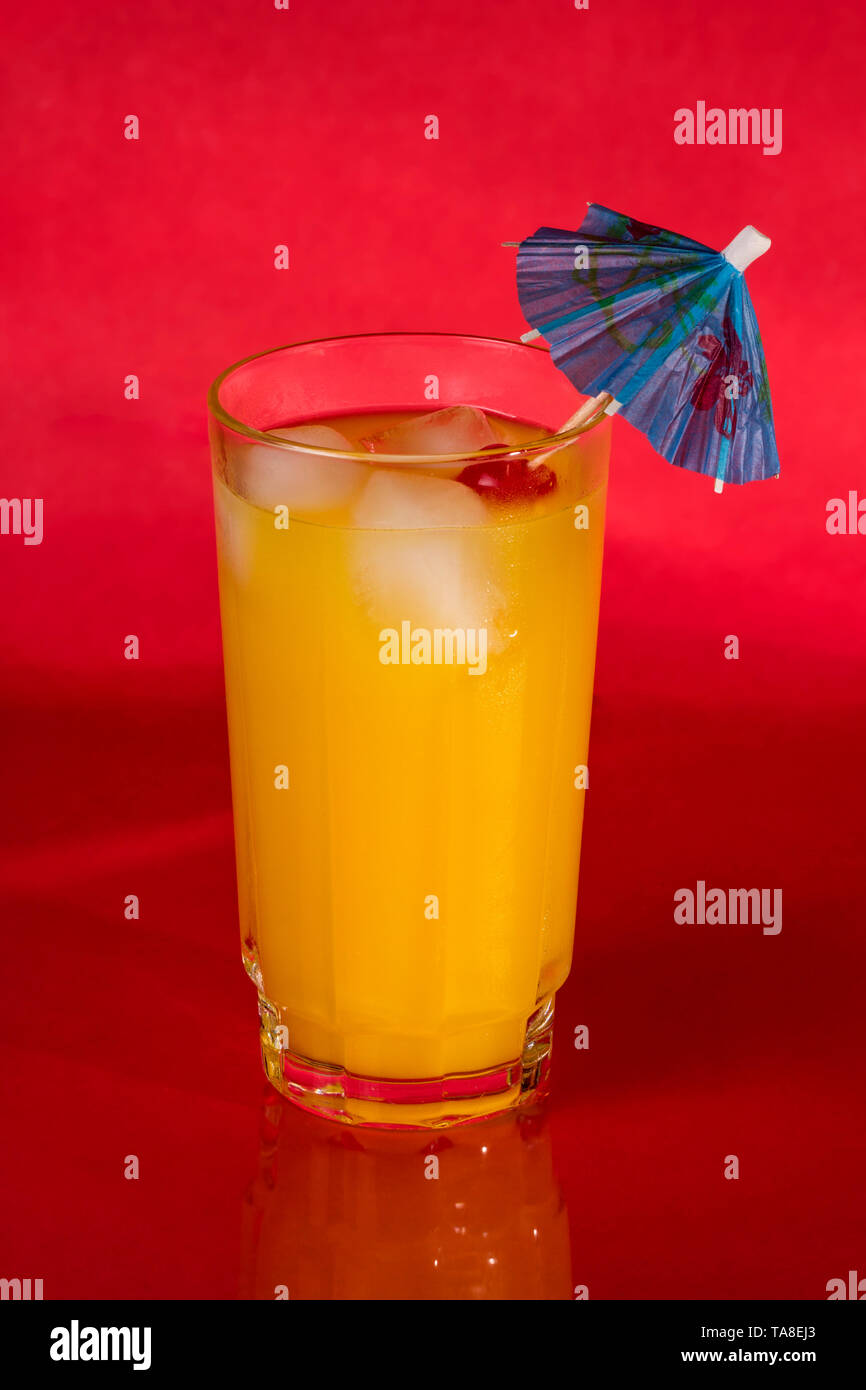 Vodka and Orange juice mixed drink with a cocktail umbrella Stock Photo