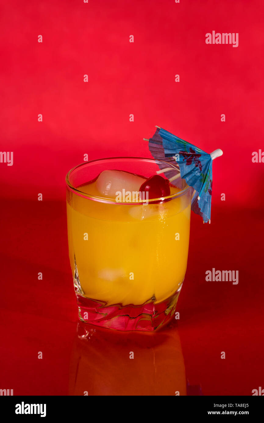 Vodka and Orange juice mixed drink with a cocktail umbrella Stock Photo