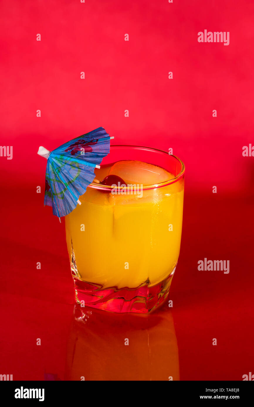 Vodka and Orange juice mixed drink with a cocktail umbrella Stock Photo