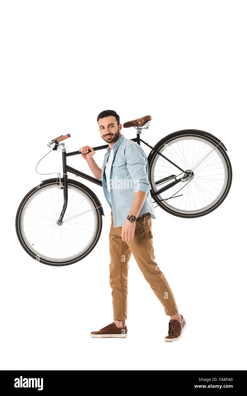 handsome man in blue shirt and beige trousers holding bicycle isolated on white Stock Photo Alamy