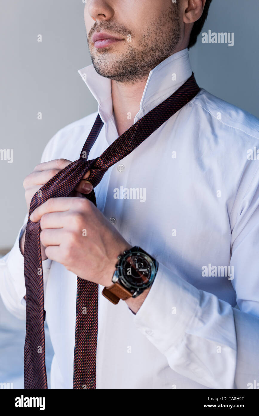 Man Putting On Tie High Resolution Stock Photography and Images - Alamy