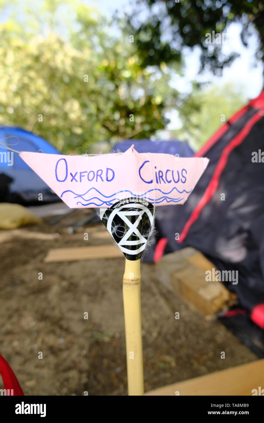 An origami boat made to symbolise the the Extinction Rebellion Oxford Circus pink boat towed away by the police during the group's mass protest. Stock Photo