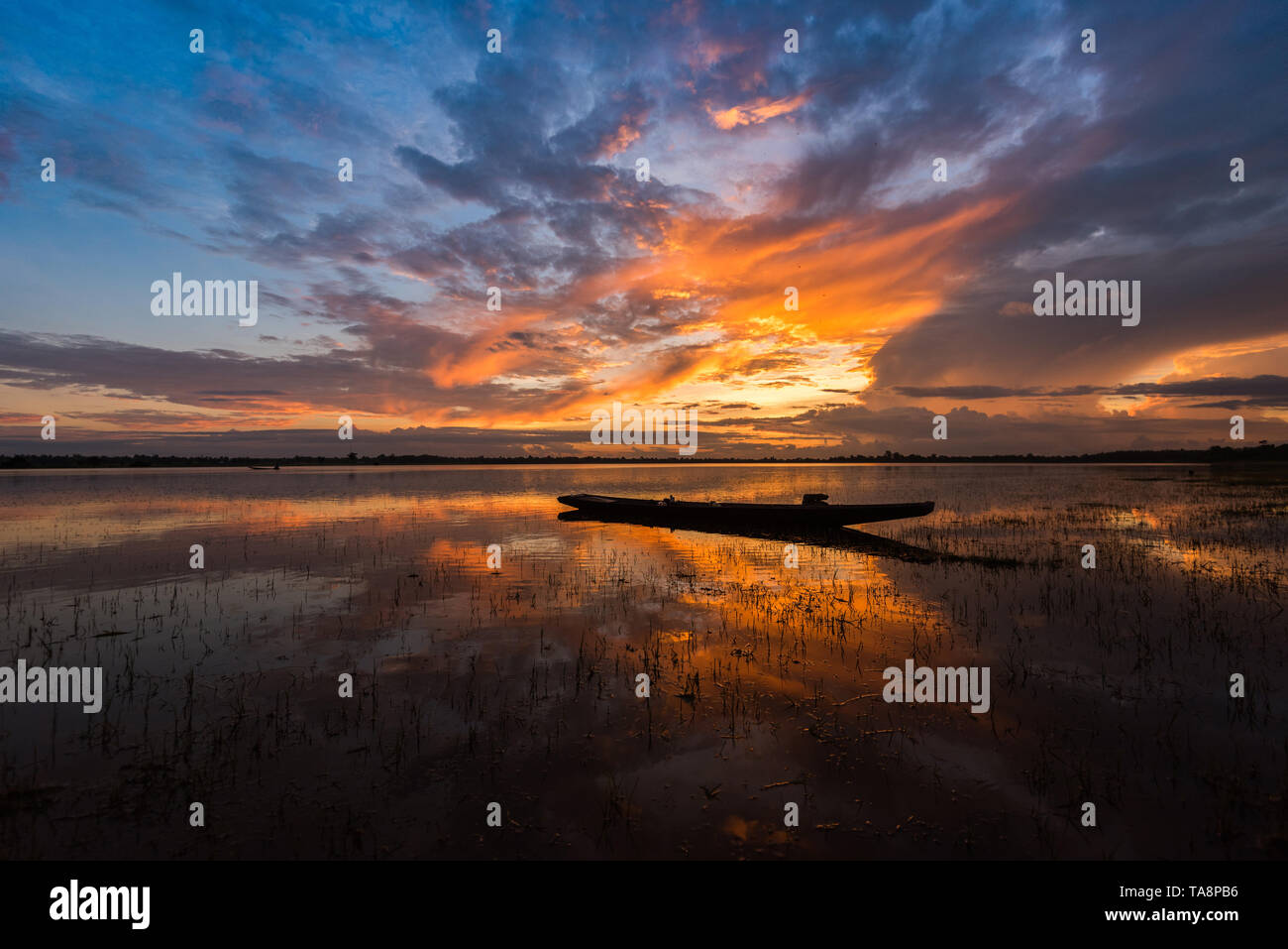 Amazing Sunset Reflection with Fishing Boat