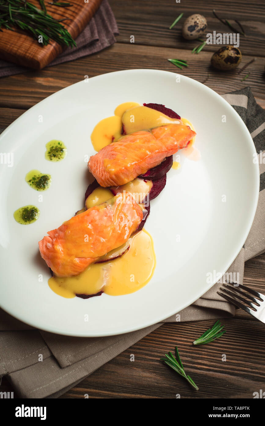 Healthy baked fish with olive oil and sauce. Menu for a cafe with