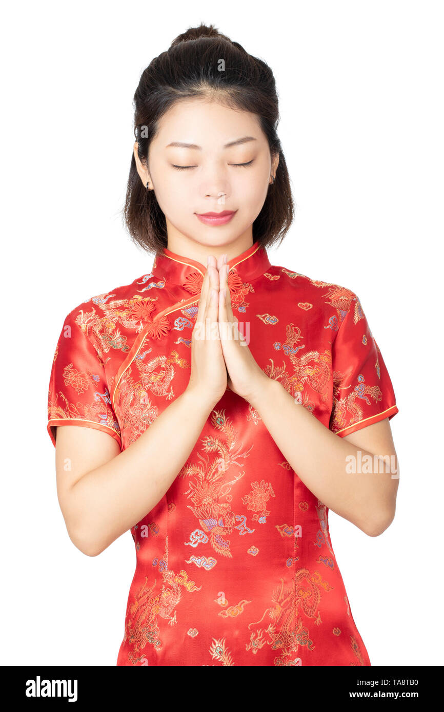 Beautiful Chinese woman wearing a traditional dress known as a Cheongsam or Chipao isolated on a white background Stock Photo
