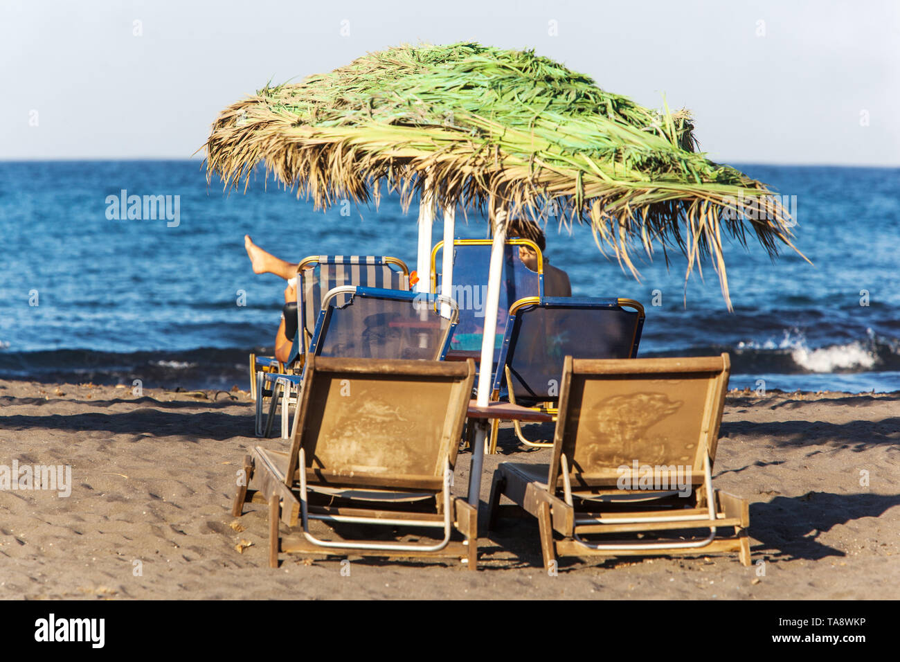 Santorini Beach, Umbrellas at Monolithos Beach Greek Islands, Greece