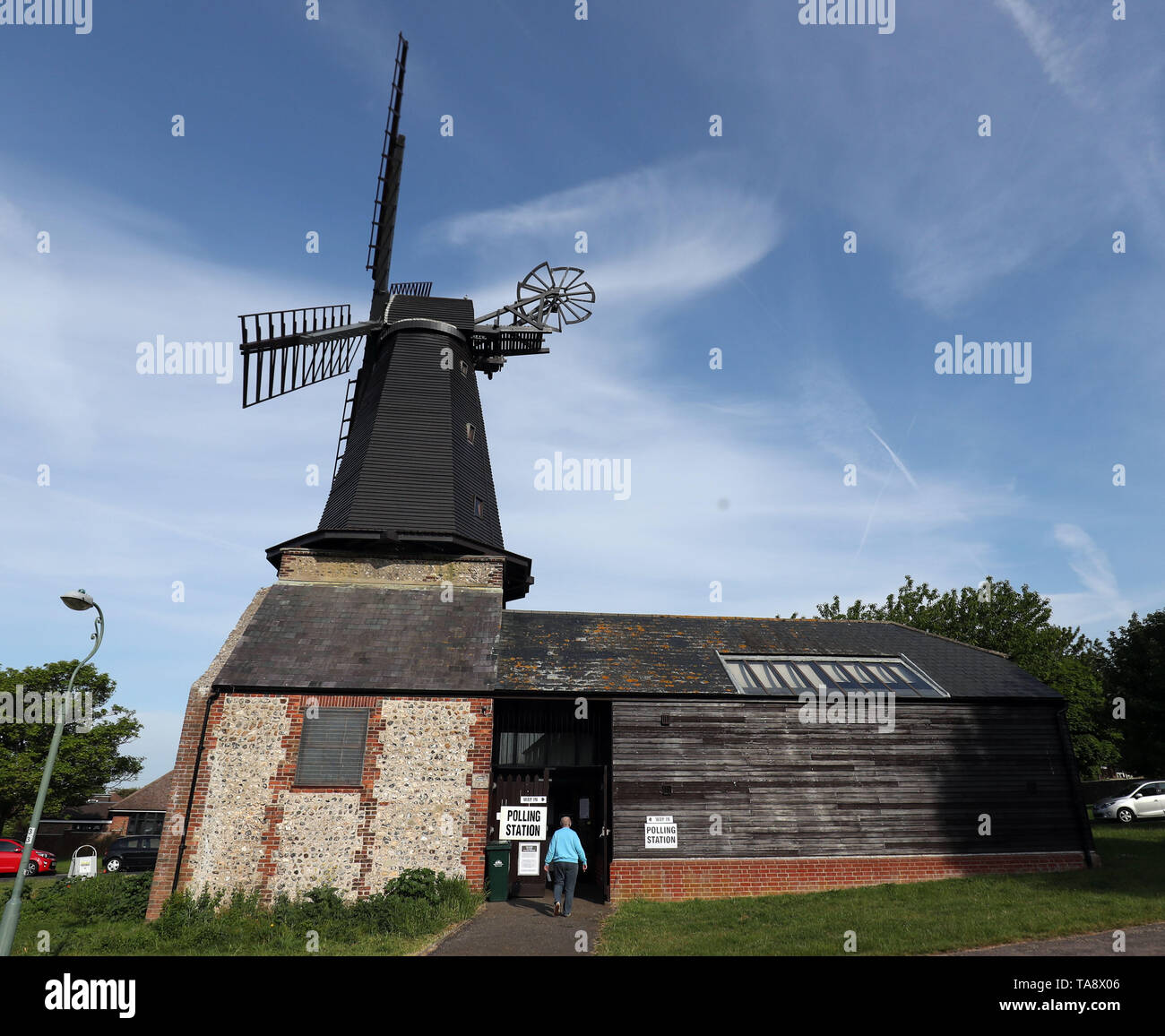 A lady arrives to cast her votes at a polling station at West Blatchington Windmill near Hove, as voters head to the polls for the European Parliament election. Stock Photo