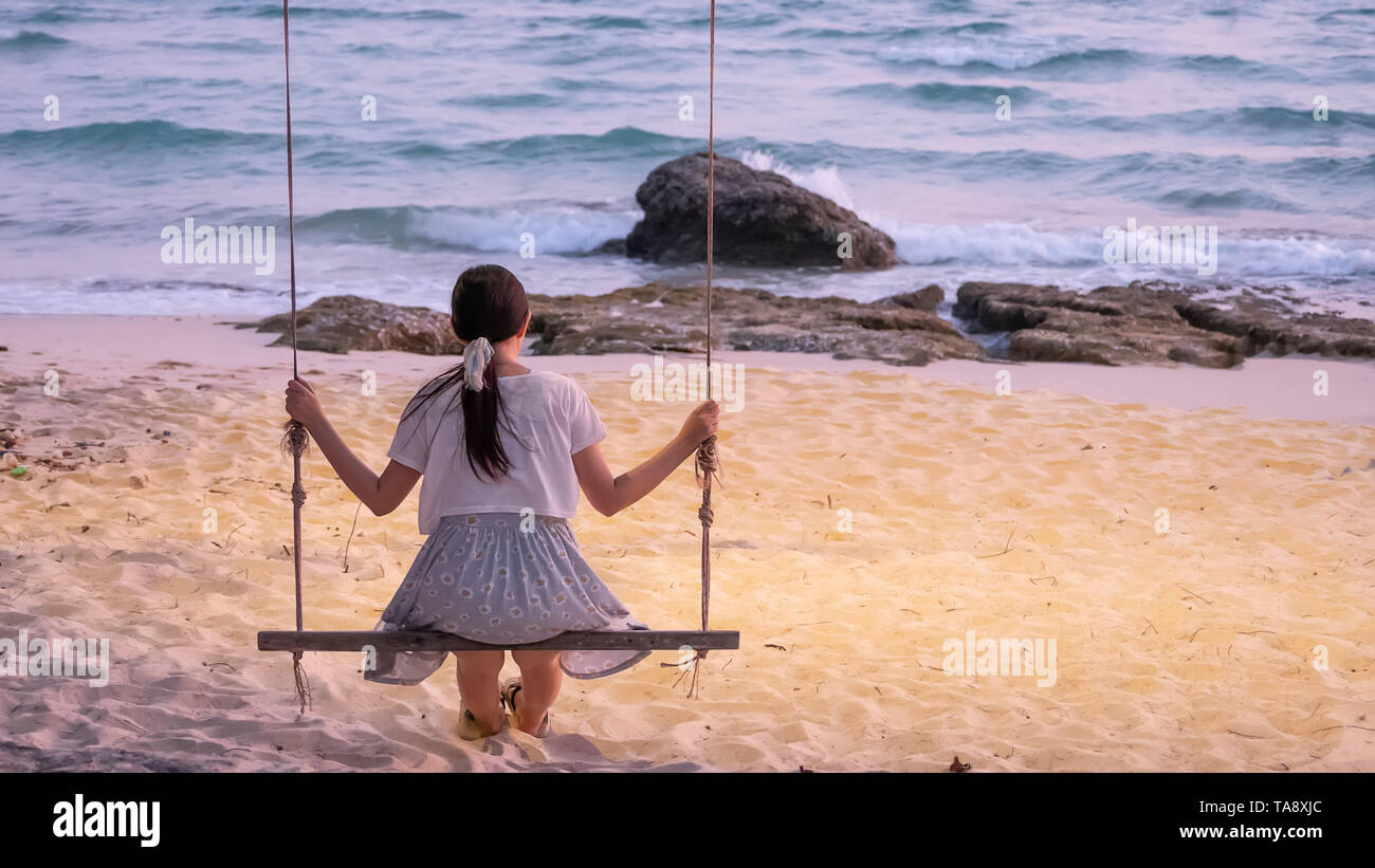Female sitting on beach alone hi-res stock photography and images - Alamy