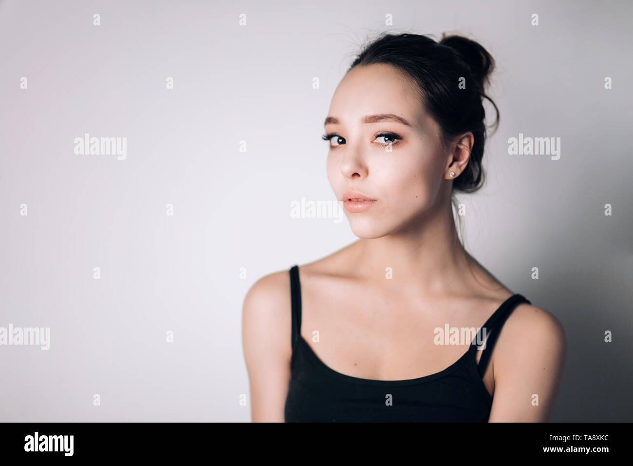 Portrait of a beautiful sad woman on white background Stock Photo - Alamy