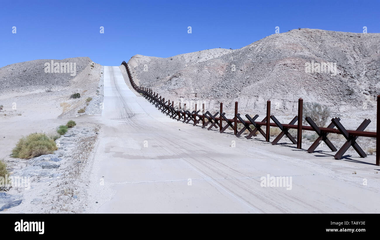 Normandy-style vehicle barrier near Calexico, California, May 20. USACE is supporting the Department of Homeland Security's request to build pedestrian fencing, construct and improve roads, and install lighting within the Yuma and Tucson, Arizona, U.S. Border Patrol sectors following the Feb. 15 national emergency declaration on the southern border of the United States. The Department of Defense has the authority under Section 284 of Title 10, U.S. Code, to construct roads and fences and to install lighting to block drug-smuggling corridors across international boundaries of the United States  Stock Photo