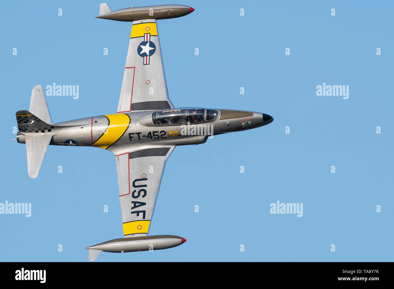 Greg Colyner flies his T-33 Shooting Star trainer jet during the Twilight Show before the Defenders of Liberty Air & Space Show at Barksdale Air Force Base, La., May 17, 2019.The airshow was first held in 1933 and is a full weekend of military and civilian aircraft and performances and displays. (U.S. Air Force photo by Senior Airman Maxwell Daigle) Stock Photo