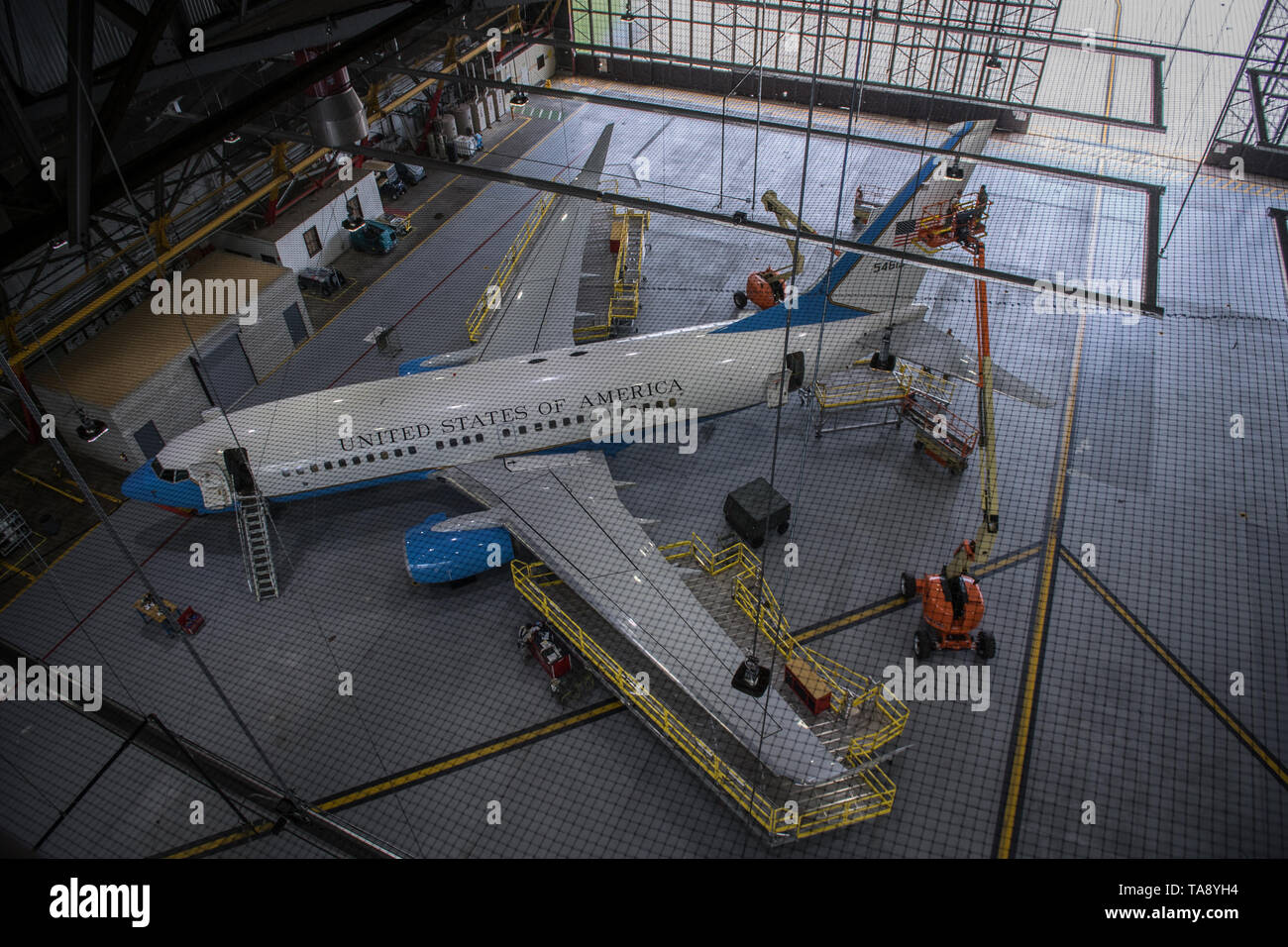 A 932nd Airlift Wing C-40C is surrounded by scaffolding and lifts as it has various routine maintenance done inside Hangar 1, Scott Air Force Base, Illinois, May 15, 2019. (U.S. Air Force photo by Christopher Parr) Stock Photo
