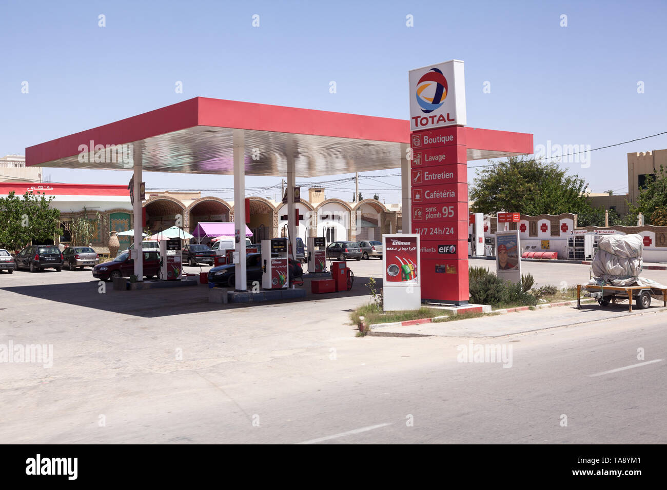TUNISIA, AFRICA-CIRCA MAY, 2012: Red colored petrol station of Total company with Effimax gasoline. Effimax is the new generation of advanced fuel cre Stock Photo
