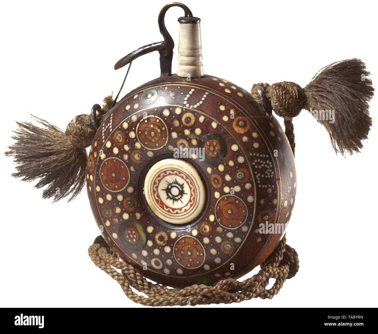 A German bone-inlaid powder flask, circa 1620 Round wooden flask with circular and dot-shaped bone and brass inlays on both sides. In both centres turned varnish-inlaid disk of bone. Spring-mounted brass closure with later bone chute. On both sides of upper edge (later) silver nails with monogram 'H R 1729' and 'H U 1821', respectively. Diameter 8 cm. historic, historical, powder flask, accessory, accessories, military, militaria, object, objects, stills, utilities, utility, clipping, clippings, cut out, cut-out, cut-outs, utensil, piece of equip, Additional-Rights-Clearance-Info-Not-Available Stock Photo