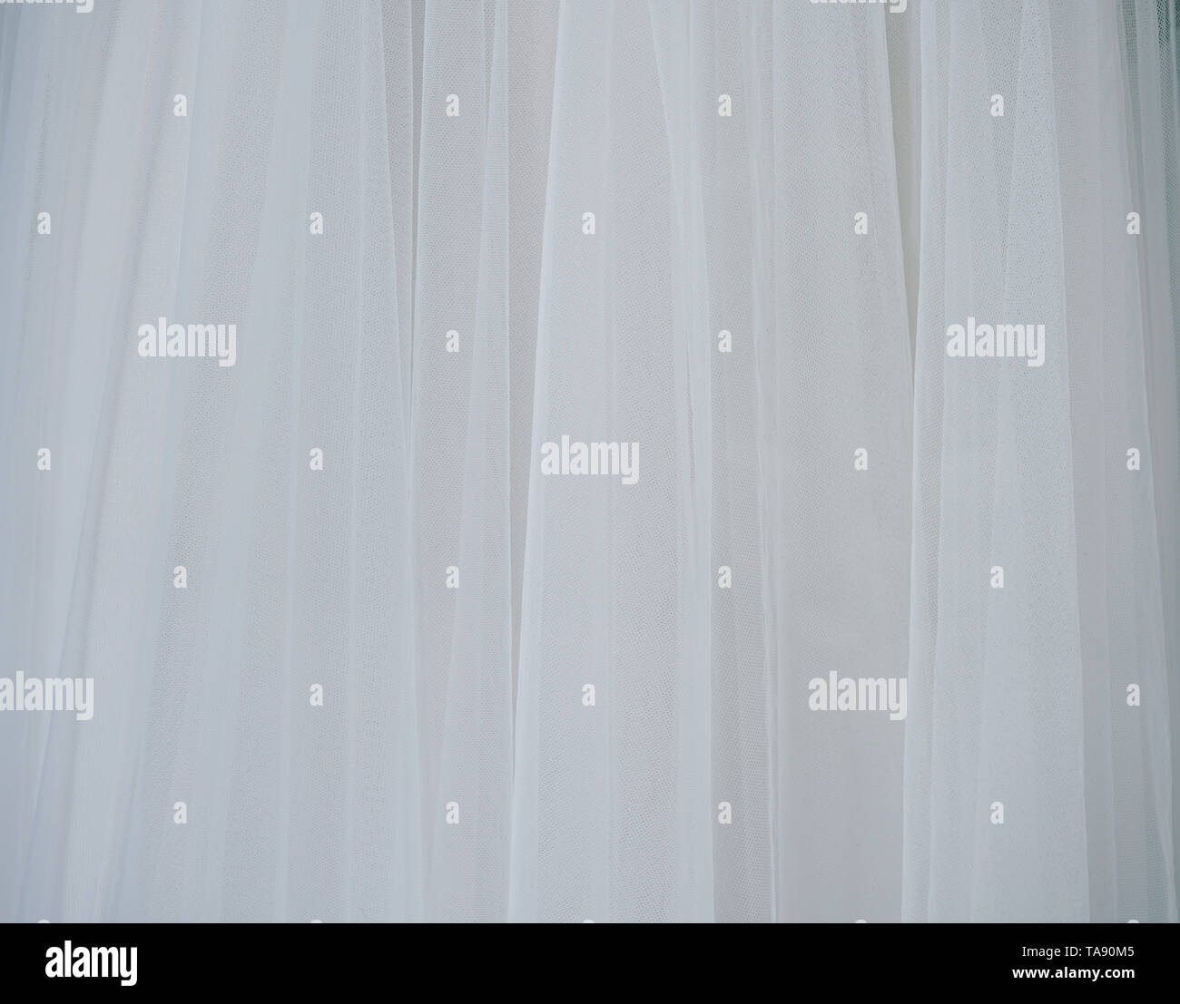 White soft tulle fabric. Interesting textured background with copy space. Stock Photo