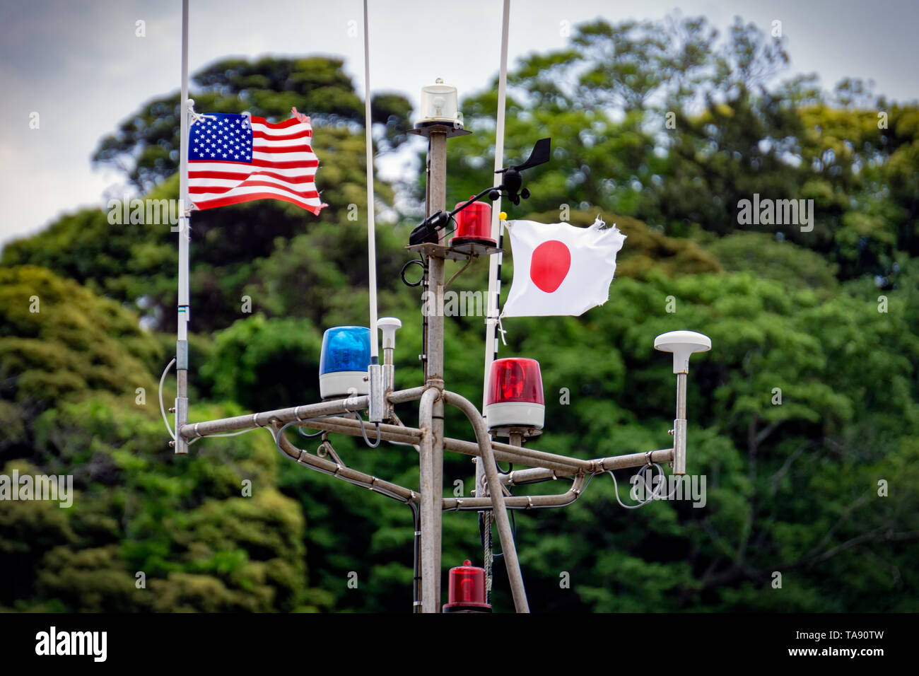 A Japanese and American flag on a boat at Shimoda, Japan. Stock Photo