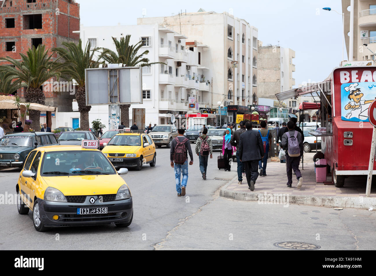 City landscape with cars and residents of a small town. Tunisia, Africa Stock Photo