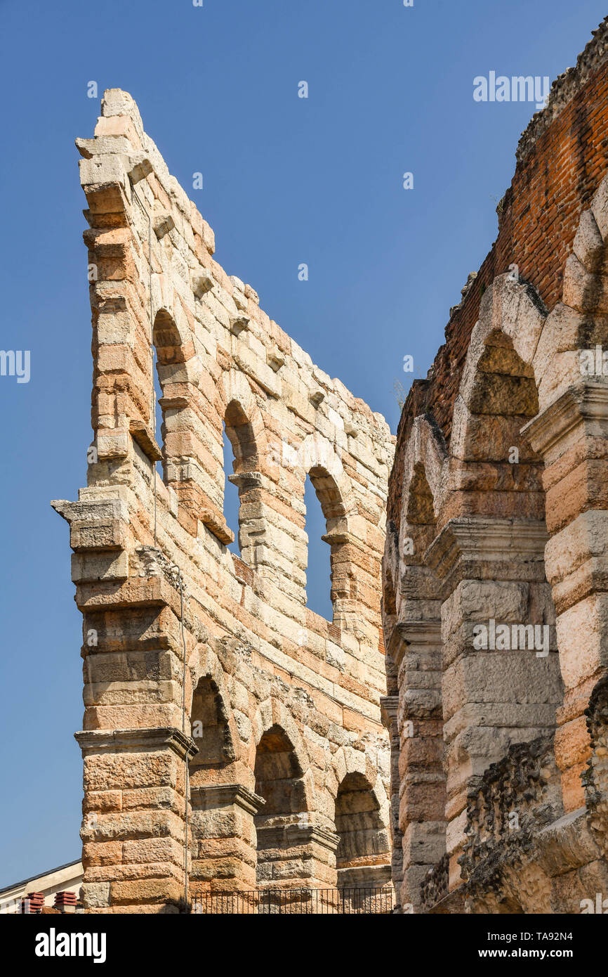 VERONA, ITALY - SEPTEMBER 2018: Walls and window arches of the Verona Arena, which is a historic Roman amphitheatre in the city centre. Stock Photo