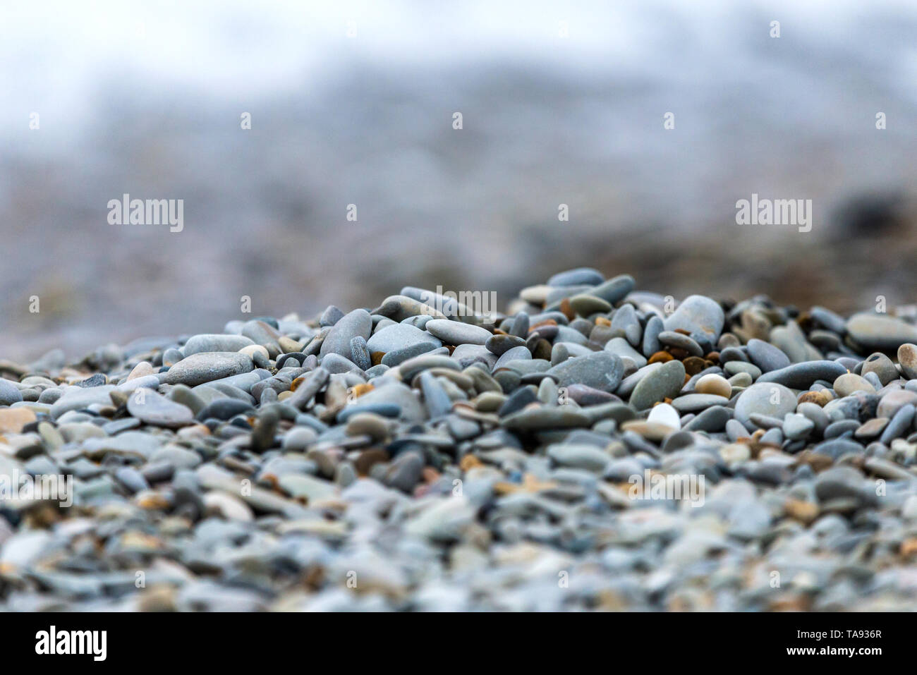 Small blue-gray stone background, natural stone pattern.selective focus. Stock Photo