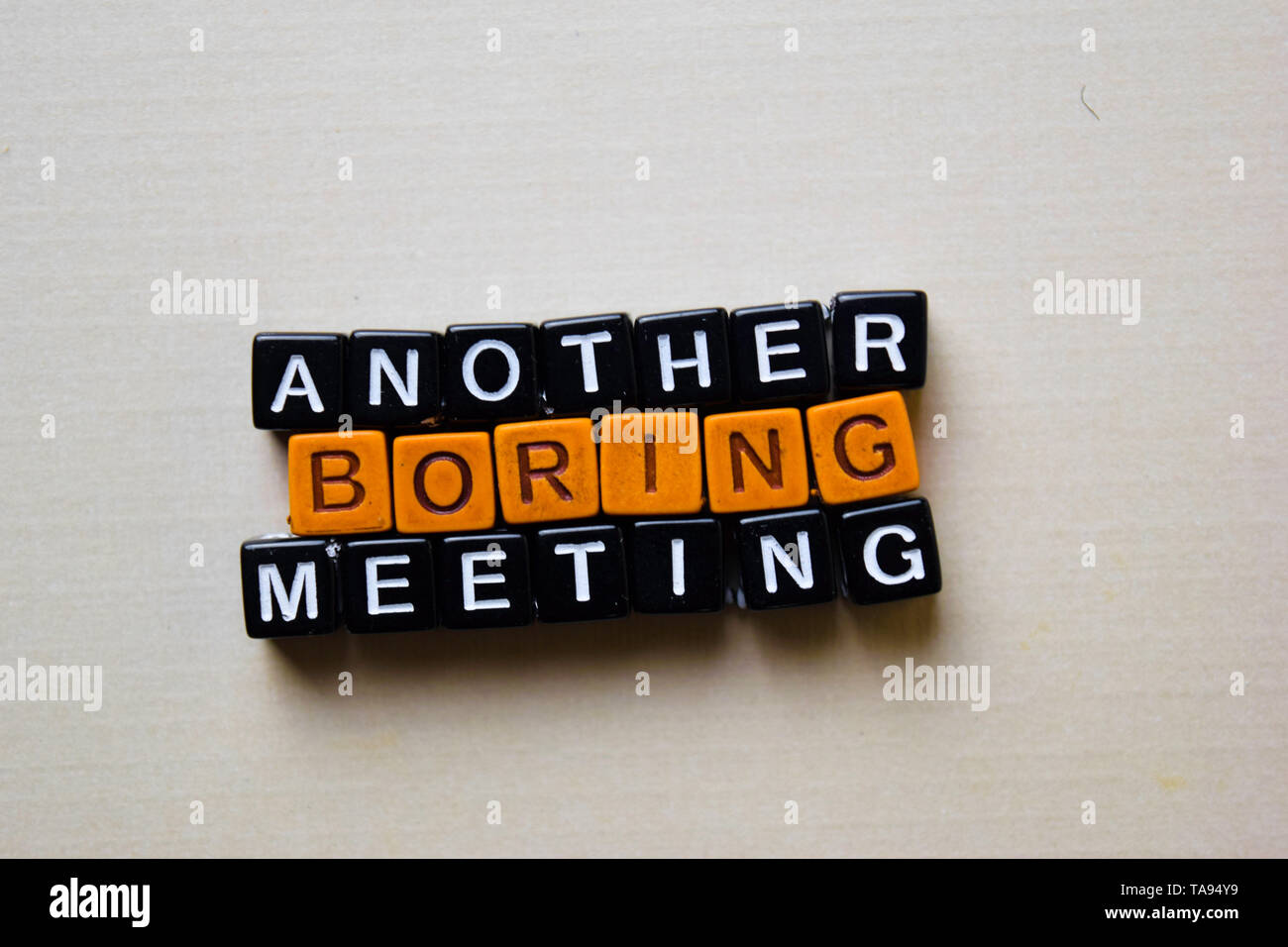 Another Boring Meeting on wooden blocks. Business and inspiration concept Stock Photo