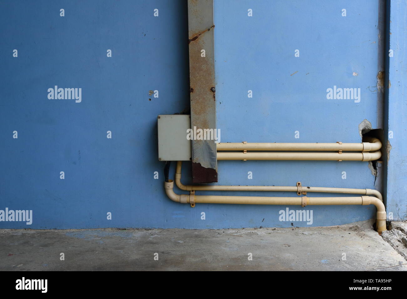 Electrical junction box and wireway connected to electrical pipes for power distribution, connection concept Stock Photo