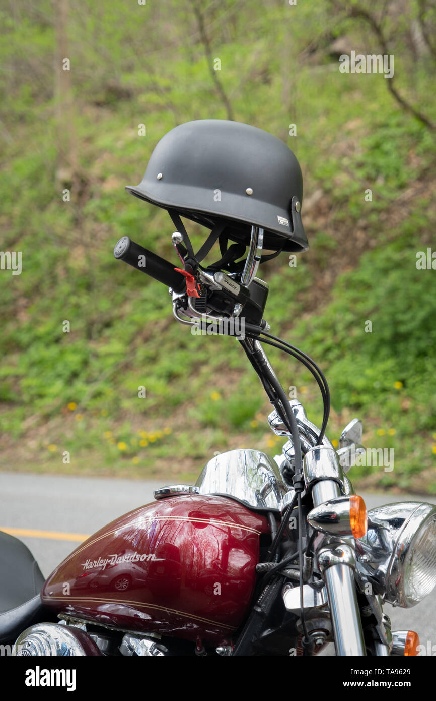 retro German style motorcycle helmet on a HARLEY-DAVIDSON DEUCE handle bar Stock Photo