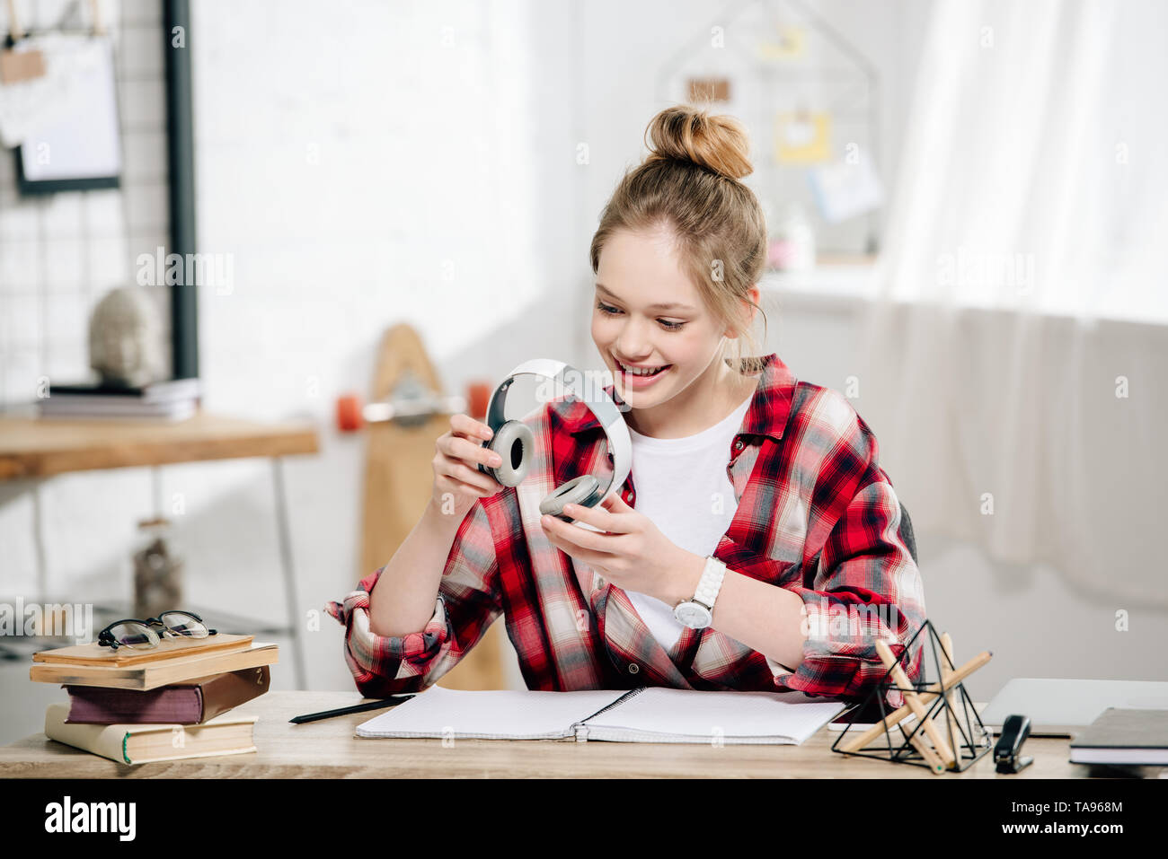 Joyful teenager sitting table hi-res stock photography and images - Alamy