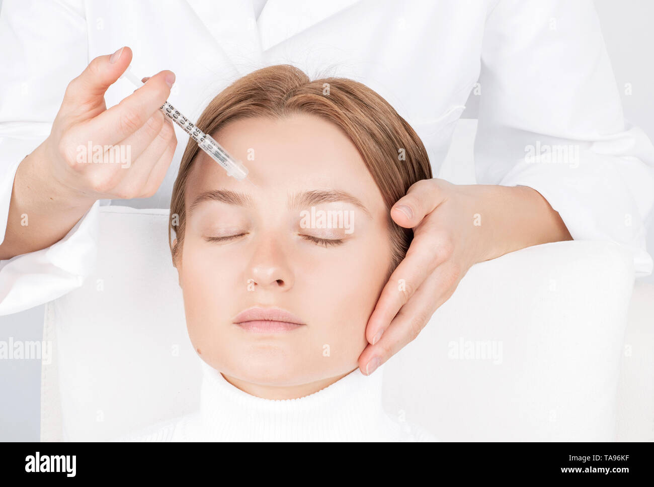 Woman is getting injection. Anti-aging treatment and face lift ...