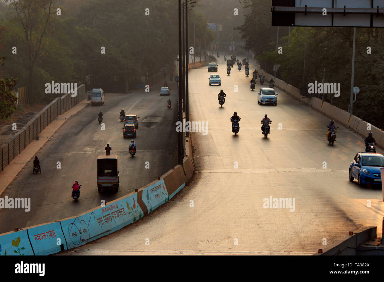 Early morning traffic on the road, Pune, Maharashtra. Stock Photo
