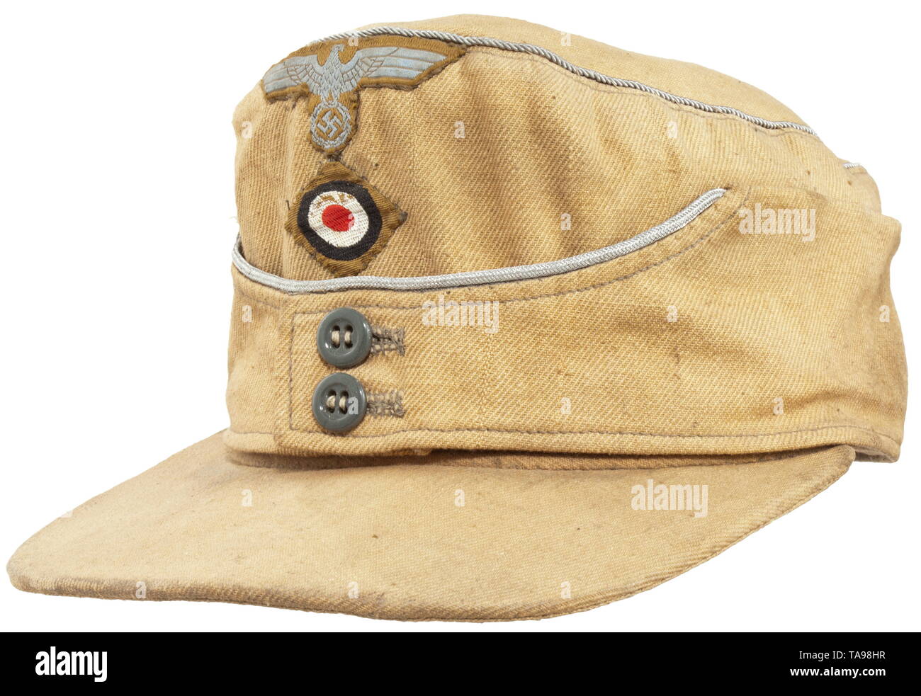 A tropical field cap for army officers Sand-coloured looted cloth with encircling officer's braid, grey glass buttons, BeVo-woven insignia (version for enlisted men), green linen herringbone lining. historic, historical, 20th century, Additional-Rights-Clearance-Info-Not-Available Stock Photo