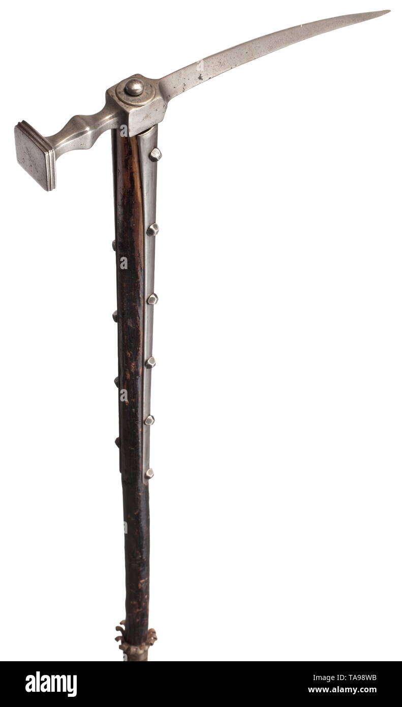 A or Hungarian war hammer, 17th century Hammerhead with long, slightly down-curved fluke and by girdles, with square striking surface. Original haft, blackened at a later date, with long side