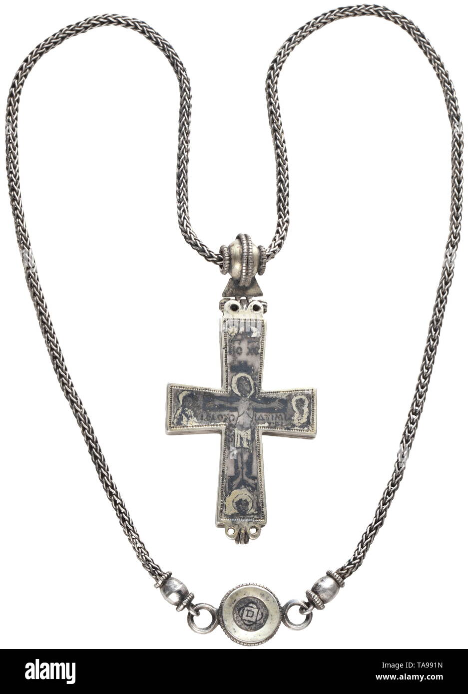 A Middle Byzantine, silver encolpion with necklace, 10th - 11th century Two-piece reliquary cross, hinged at bottom and with movable suspension at top. Biconical pearl with filigree decoration at either side and on the central edge over the triangular hinge plate. Laced through this suspension a massive foxtail necklace of 5 mm diameter. The closure is a medallion with gilt border and side rings, to which the chain ends are connected by barrel shaped beads with filigree borders. The inside surfaces with n middle ages, Additional-Rights-Clearance-Info-Not-Available Stock Photo