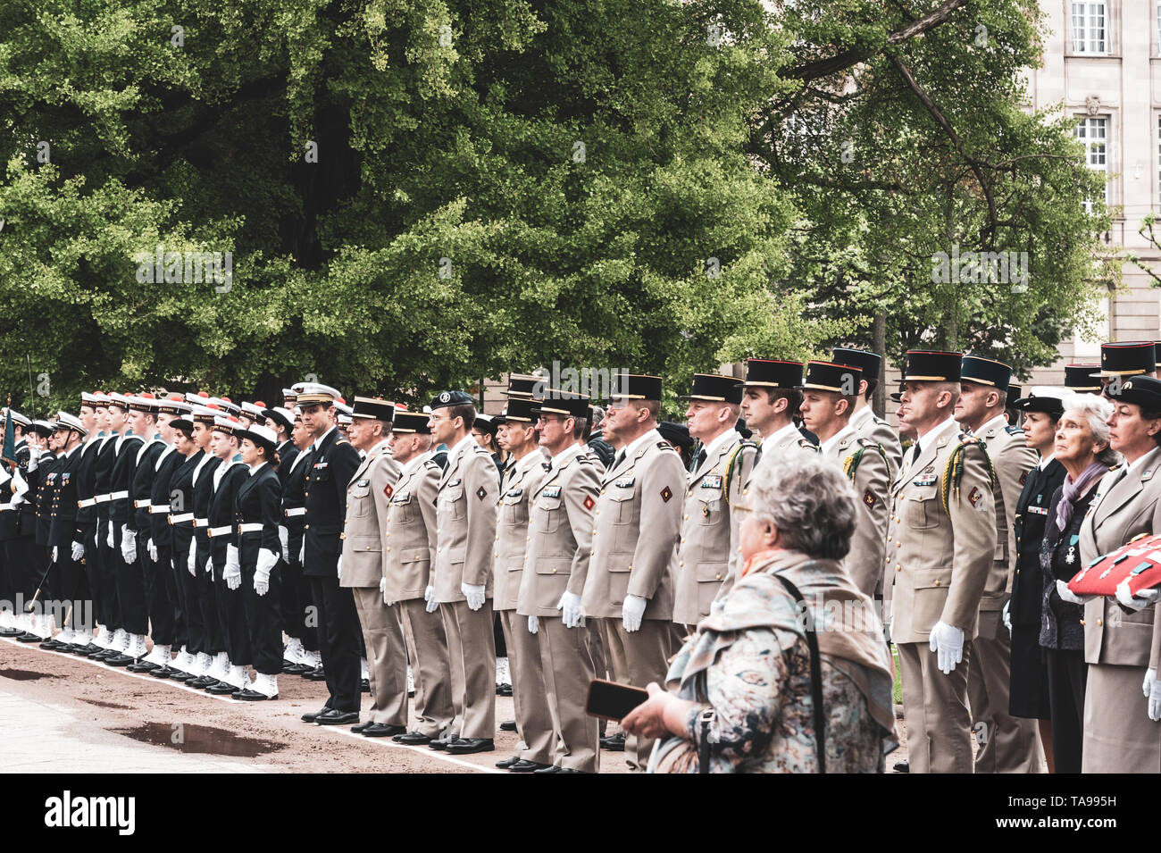 STRASBOURG, FRANCE - MAY 8, 2017: Side view of large group of military personnel at ceremony to mark Western allies World War Two victory Armistice in Europe  victory over Nazi  Stock Photo