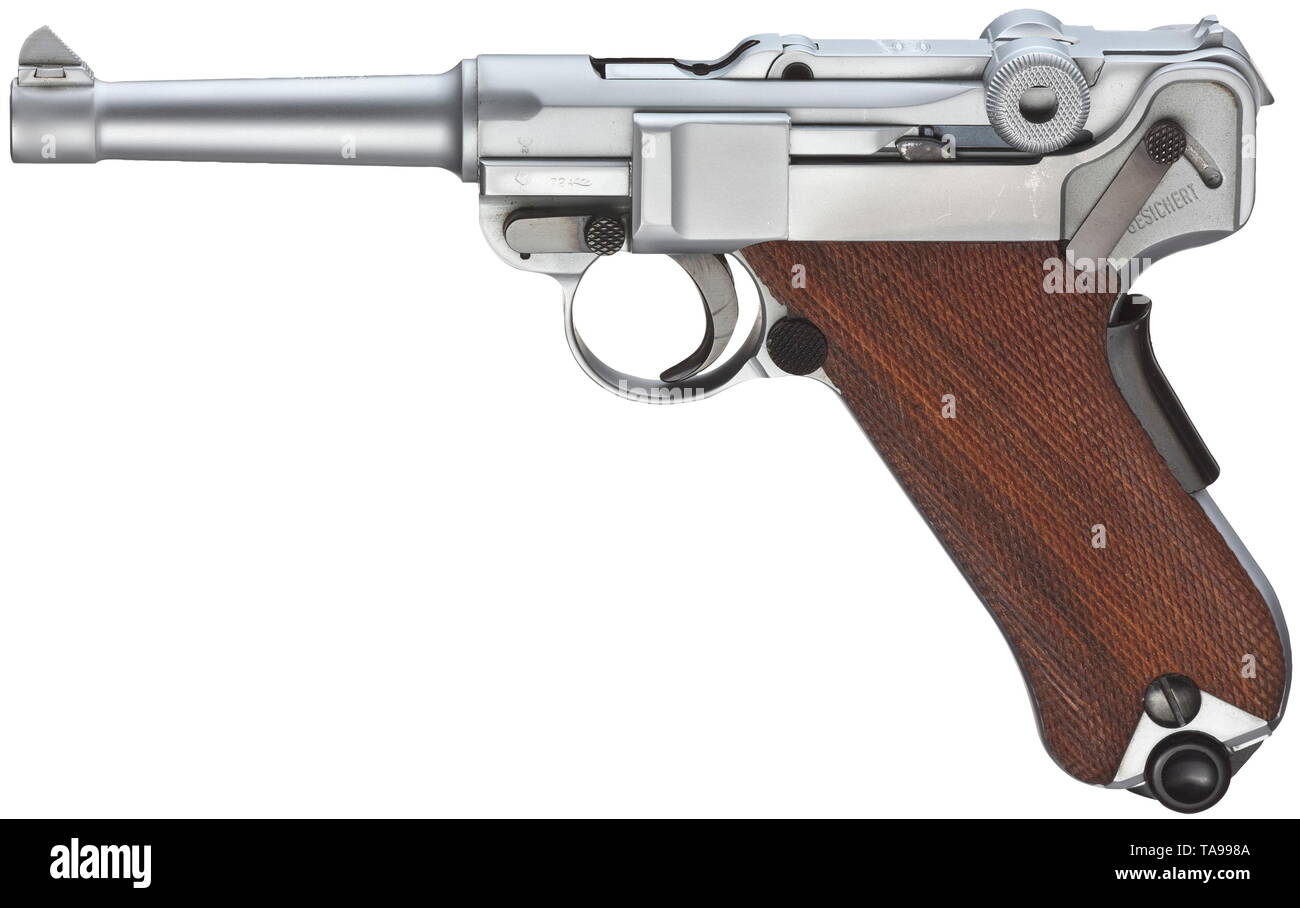 A Mauser Parabellum, matt chrome-plated, in box Cal. 9 mm Parabellum, no. 11.009958. Matching numbers. Mirror-like bore, length 100 mm. German proof mark 1972. Grip safety. Main parts chromed matt. Operational parts finished black. Walnut grip panels. Magazine also chromed matt, with black plastic base. Weapon with most minimal signs of storage. In original, lightly damaged box, with spare magazine, blued body, key, instructions and test target. Erwerbsscheinpflichtig. historic, historical, civil handgun, civil handguns, handheld, gun, guns, fire, Additional-Rights-Clearance-Info-Not-Available Stock Photo