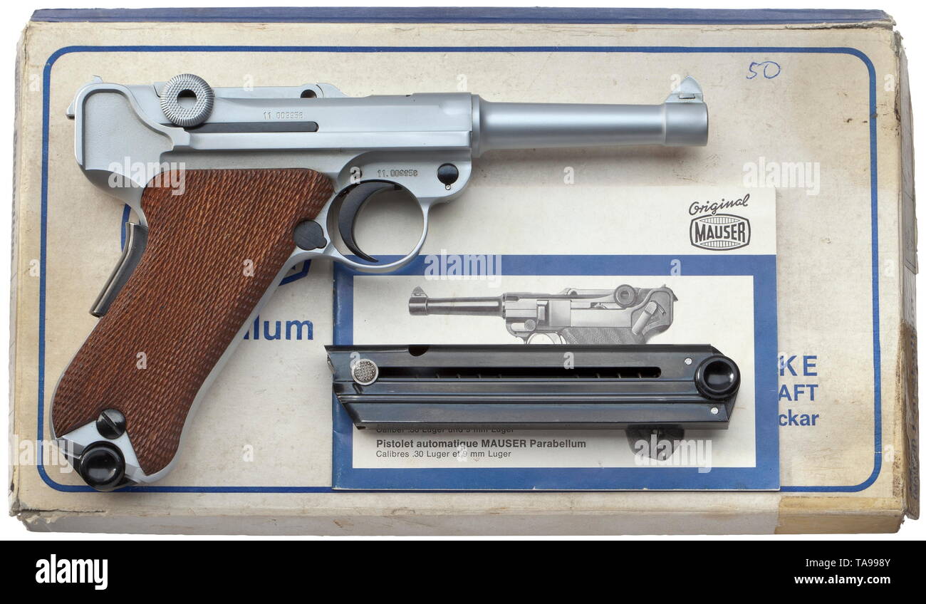A Mauser Parabellum, matt chrome-plated, in box Cal. 9 mm Parabellum, no. 11.009958. Matching numbers. Mirror-like bore, length 100 mm. German proof mark 1972. Grip safety. Main parts chromed matt. Operational parts finished black. Walnut grip panels. Magazine also chromed matt, with black plastic base. Weapon with most minimal signs of storage. In original, lightly damaged box, with spare magazine, blued body, key, instructions and test target. Erwerbsscheinpflichtig. historic, historical, civil handgun, civil handguns, handheld, gun, guns, fire, Additional-Rights-Clearance-Info-Not-Available Stock Photo