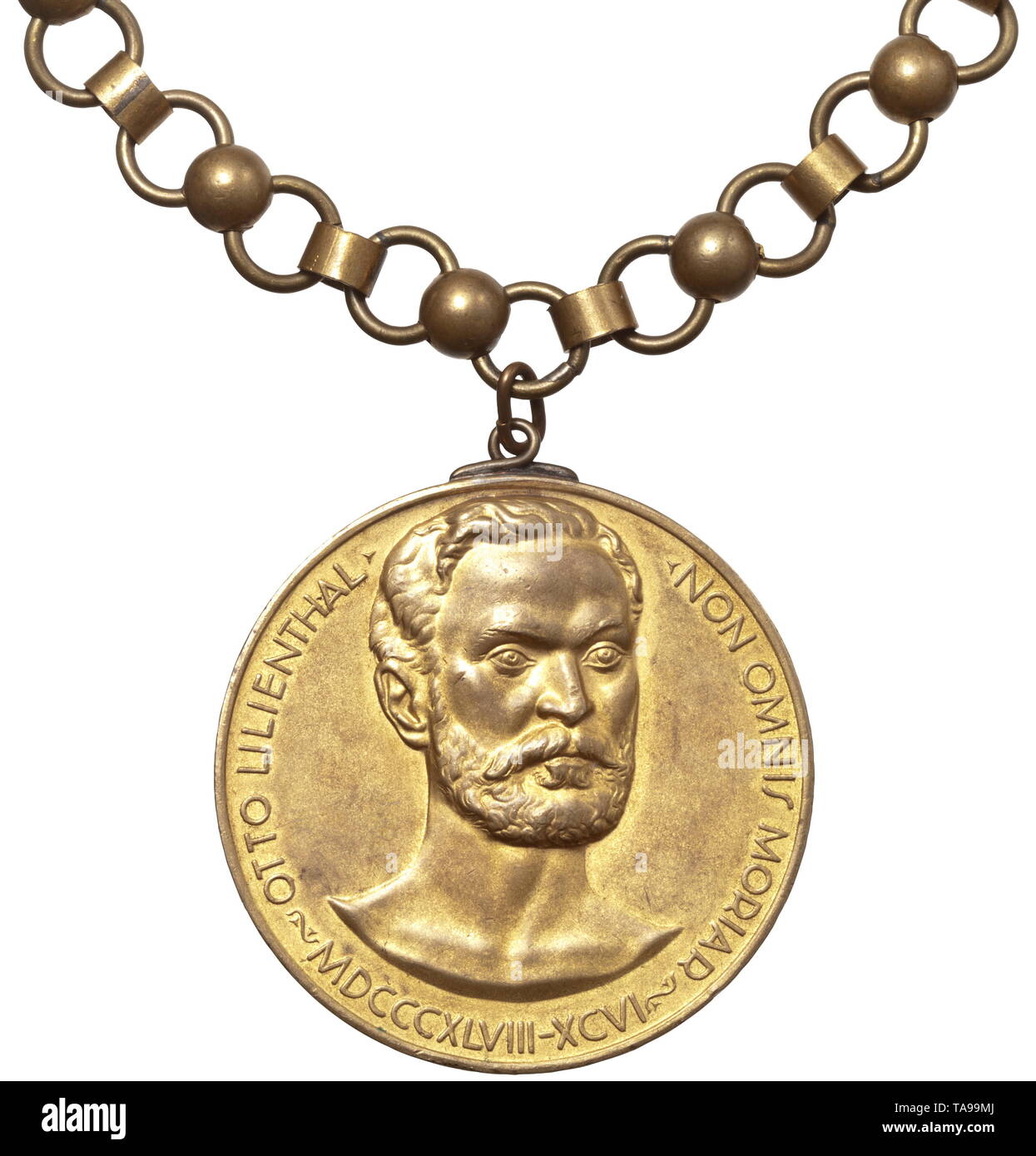 An Otto Lilienthal badge - Scientific Aviation Society Award for wear consisting of a large gilt medal with 65 mm in diameter. On the obverse depiction of Otto Lilienthal with circumscription '1843-96' and motto 'Non Omnis Moria' (tr. 'I will not die'), the reverse with inscription 'Für hervorragende Verdienste - Die wissenschaftliche Gesellschaft für Luftfahrt' (tr. 'For outstanding achievements - the Scientific Aviation Society'). On a long multi-link chain with elements made of non-ferrous metal, length circa 80 cm. Both medal and chain unmark, Additional-Rights-Clearance-Info-Not-Available Stock Photo