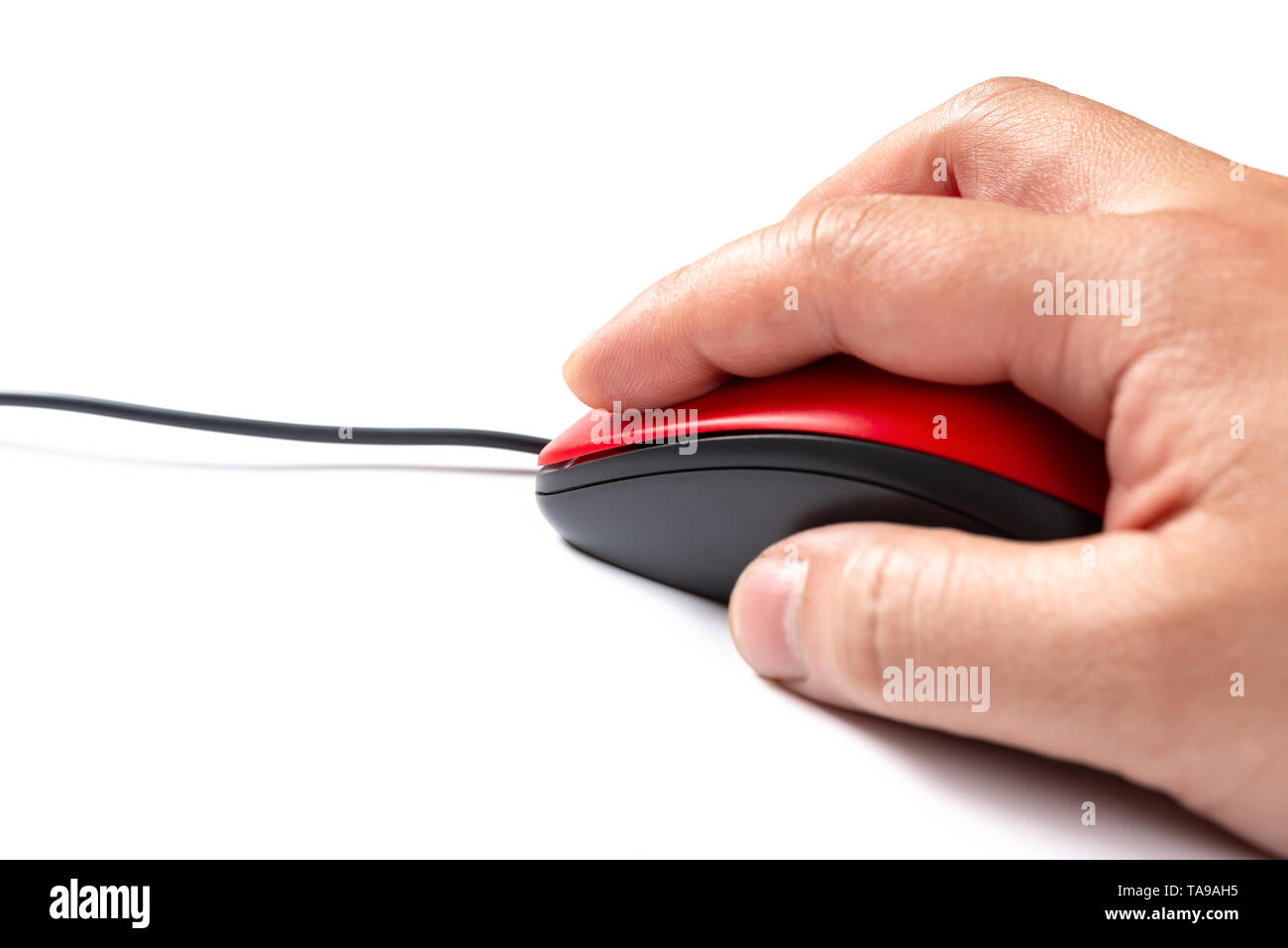 side view man using a red mouse on a blue background Stock Photo