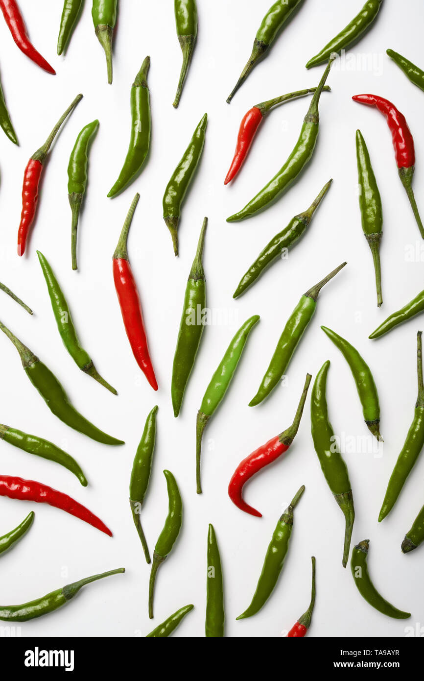 Red and green hot chilli pepper on white background Stock Photo - Alamy