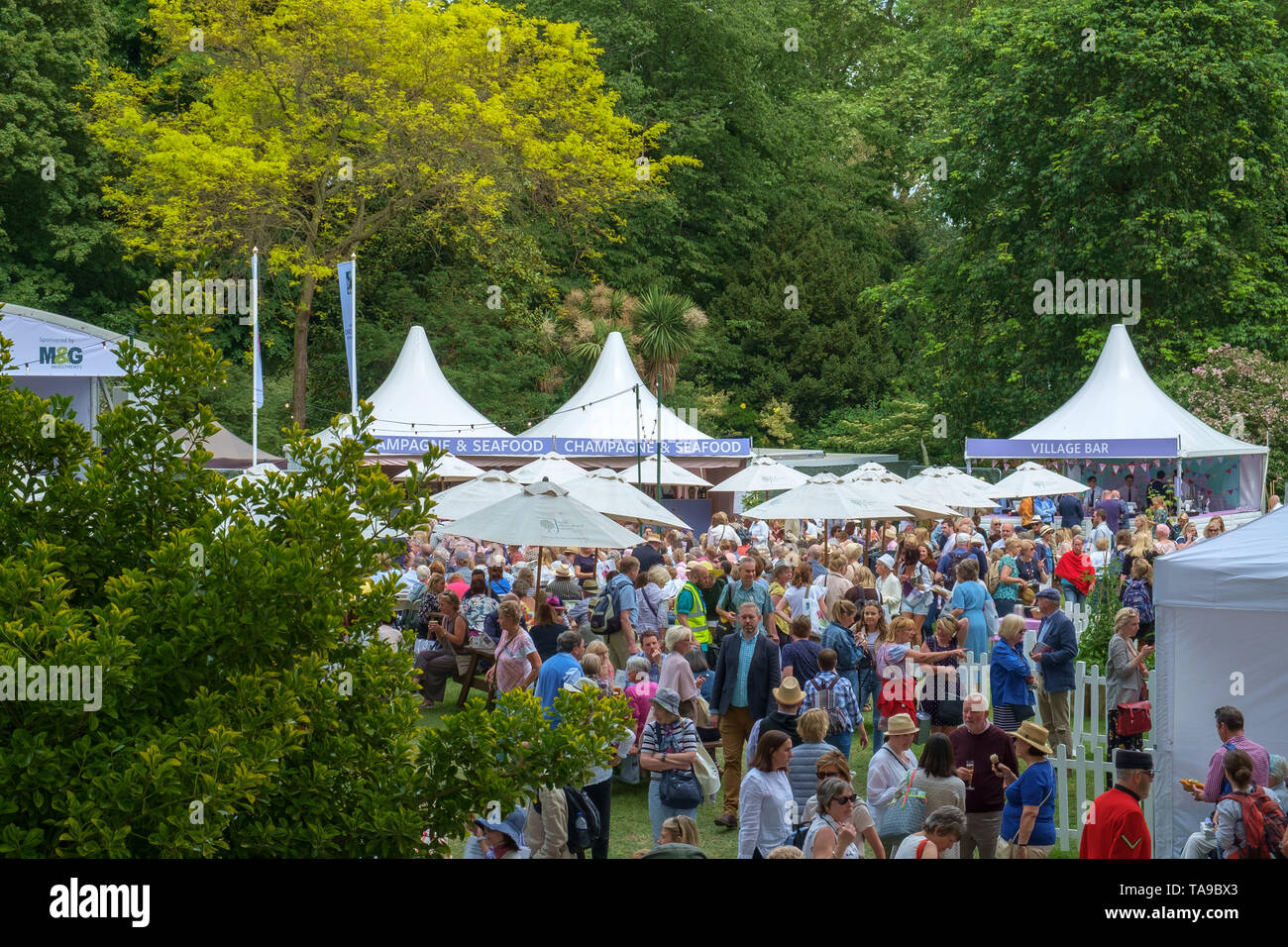 London, UK - May 22nd 2019: RHS Chelsea Flower Show, the tented village where the crowds of visitors enjoy food and drink. Stock Photo