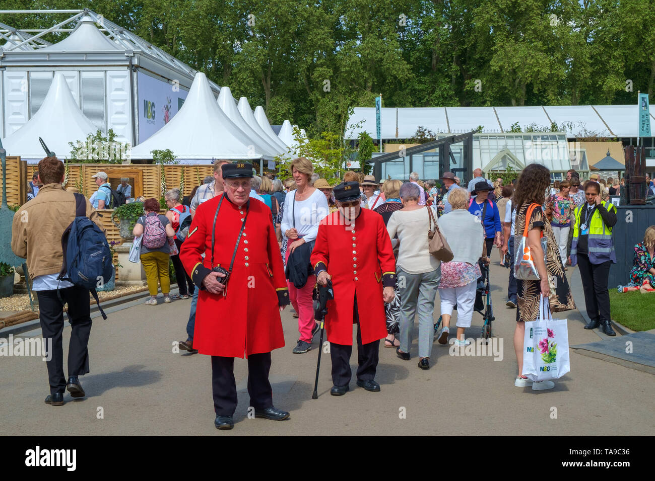 London, UK - May 22nd 2019: RHS Chelsea  where the Chelsea Pensioners in their bright red uniforms mix with visitors at the show. Stock Photo