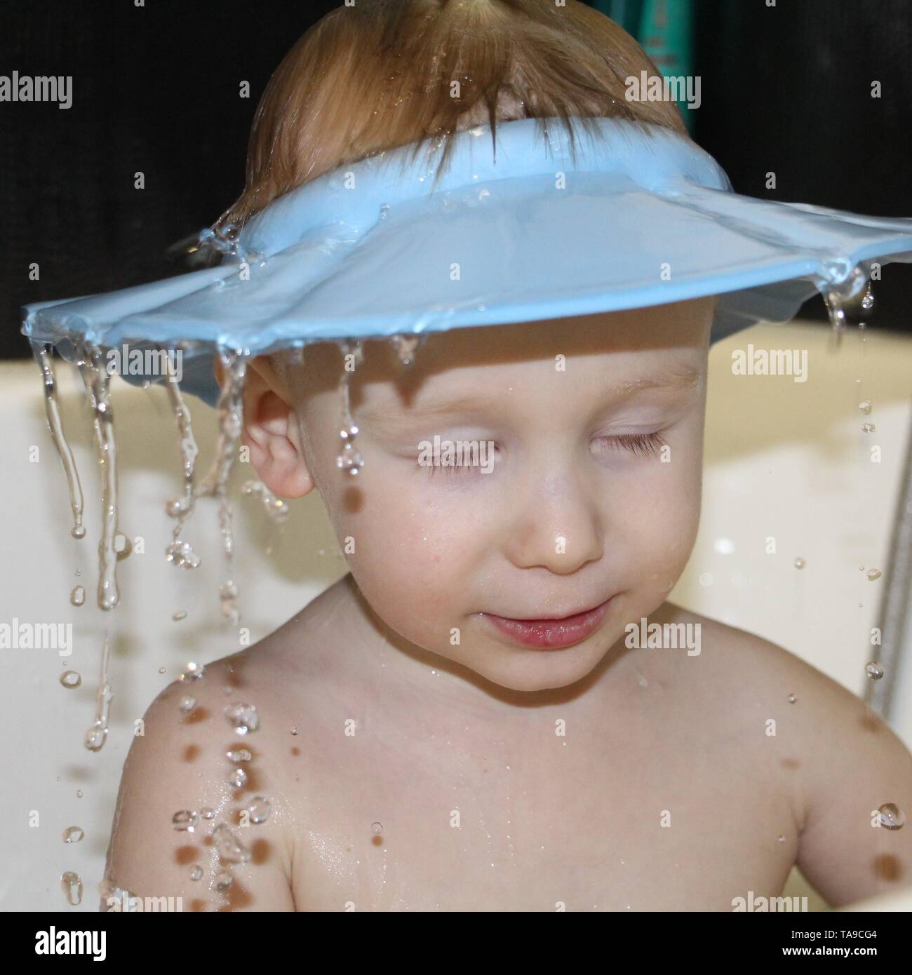 Visor from water for washing the head. Water is poured over the head of